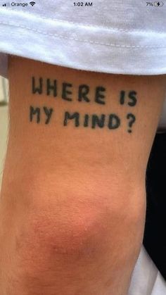 a person with a tattoo saying where is my mind?