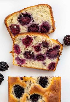 two pieces of bread with berries on the top and one slice cut off from it