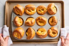 freshly baked bagels on a baking tray ready to be eaten by someone in the kitchen