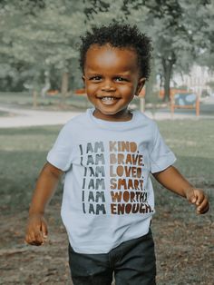 I Am Affirmations for Kids Shirt Uplift your child's spirits with our Kids I Am Affirmations Shirt! Each day, let them embrace the positive power of self-affirmation with this uplifting tee. Crafted to inspire and empower, the shirt boldly declares 'I Am Kind, I am Brave, I am Loved, I Am Smart, I Am Worthy, I Am Enough.' Encourage a positive mindset and boost their confidence with these affirmations for kids. This shirt is more than just fabric; it's a tool for cultivating resilience and fostering self-love. Dress your little one in positivity, promoting a bright outlook on life. Details 100% cotton white; short sleeve + long sleeve created to inspire our youth heat transfer apparel decorating method made in Philadelphia, PA by a woman-owned, minority-owned small business Processing Time I Am Shirt, Affirmation Tshirt, Positive Affirmation Shirts, Positive Tshirt Ideas, Kids Tshirt Ideas, Words Of Encouragement For Kids, Kids Tshirt Designs, Toddler Girls Leggings, Motivational Slogans