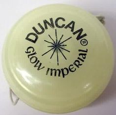 a yellow frisbee with the duncan logo on it's back side