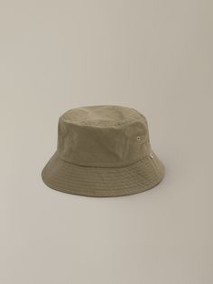 Editor's NoteThe classic look is reinterpreted in a modern sense. - Basic designed cotton bucket hat- Lightweight and durable- NW embroidery logo label- Washed material used to resist wrinkles Measurements (in.)- Head Girth: 23.62 in.- Height: 2.17 in. Composition & Care- 100% Cotton- Avoid direct heat and moisture- Do not tumble dry- Products may be damaged by alcohol, oil, cosmetics, etc. Designer- by NOTHING WRITTEN Khaki Cotton Bucket Hat With Short Brim, Khaki Brimmed Cotton Bucket Hat, Khaki Cotton Wide Brim Bucket Hat, Khaki Cotton Bucket Hat With Curved Brim, Khaki Cotton Sun Hat With Curved Brim, Classic Cotton Bucket Hat With Curved Brim, Nothing Written, Cotton Hat, Logo Label