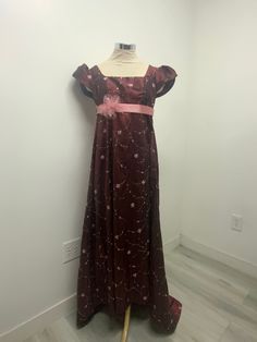 Beautiful regency style dress made with burgundy/wine embroidered taffeta fabric and petal style sleeves very light dress with a small train.please note it takes me 5-8 business days to produce and ship your dress after you place your order. THERE  IS NO RETURNS OR EXCHANGES ACCEPTED  PLEASE BE SURE TO CHECK THE MEASUREMENTS ON THE BOTTOM OF THE DESCRIPTION. If for any reason the measurements don't  match with yours be sure to provide to me at the time of order. PLEASE NOTE COLOR MAY BE A LITTLE DIFFERENT ONCE YOU SEE IT, If measurements are not provided at the time of purchase we will send the dress with the measurements provided here on the listing PLEASE ADVISE OF THAT SMALL / BUST / Length                  32-34.     44 MED   /    36-38 /  46 LARGE /. 40-42/ 48  The small dress is made Fitted Burgundy Ball Gown Evening Dress, Red Victorian Dress With Fitted Bodice, Elegant Red Victorian Dress With Fitted Bodice, Burgundy Ball Gown For Evening, Burgundy Floor-length Evening Gown, Red Fitted Victorian Dress In Regency Style, Regency Style Fitted Silk Dress, Fitted Silk Regency Dress, Fitted Silk Regency Style Dress