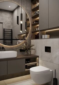 a bathroom with a large round mirror above the sink