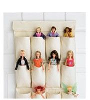 the barbie dolls are lined up in their beddings to be made into pillows