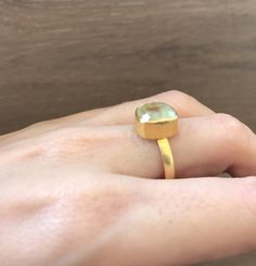 "A cushion shaped Prehnite, which is a lovely soft green hue make a great stackable ring. Wrapped in a box ready for gift giving.(r-117) Final Sale Prehnite measure 10.5mm ---> Don't know your ring size? Purchase our ring sizing gauge https://www.etsy.com/listing/290720637/ring-sizer-ring-sizing-gauge-multisizer?ga_search_query=ring+sizer&ref=shop_items_search_1 *Follow us @instagram for promotions *LIKE* us on Facebook http://www.facebook.com/Belesas to find special coupon codes *If you Green Stone Ring, Chalcedony Ring, Green Chalcedony, Square Ring, Bezel Ring, Square Rings, Ring Sizer, Stackable Ring, Green Onyx