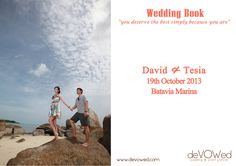 a man and woman holding hands on top of rocks near the ocean with text reading wedding book david & tesia 1940 october 2013