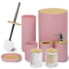 pink bathroom accessories including soap dispenser, toothbrush holder and tumbler