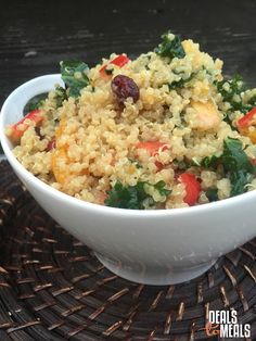 a white bowl filled with rice and vegetables