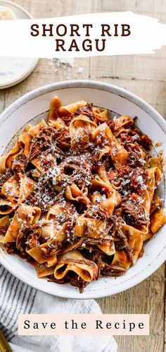 a white bowl filled with pasta covered in sauce