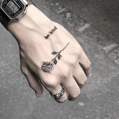 a person's hand with a tattoo on it