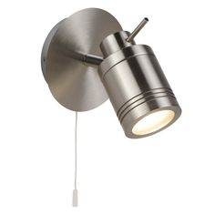 a light that is on the side of a wall mounted lamp with a cord attached to it