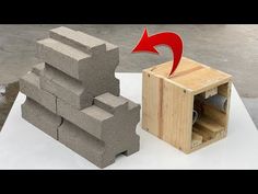 an object made out of cinder blocks with a red arrow pointing to it