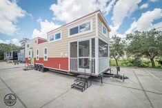 a tiny house is parked in the parking lot