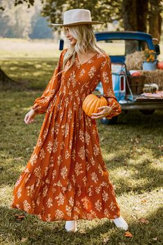 The Burnt Orange Floral Blouson Sleeve Smocked Waist Maxi Dress combines stunning florals with a flattering smocked waist for a look that's both comfortable and captivating. Product code: CAA05A4J076KK Features:  Woven V-neckline Blouson sleeves Smocked waist Maxi Wash Method: Regular Wash Material: 100%RAYON. Joanna Gaines Style Clothes, Modest Fall Dresses, Joanna Gaines Style, Smocked Maxi Dress, Halloween Trends, Fall Maxi, Maxi Dress Winter, Orange Floral Dress, Burnt Orange Dress