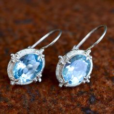 Renaissance jewelry is splendidly reborn. Our blue topaz ensemble belongs at a ball, or at least at a local disco. Sterling silver settings augment the brilliant sparkle of the stones. European backs. Size: 1 Inch. Silver Topaz Earrings With Gemstone Accents, Silver Topaz Birthstone Earrings, Silver Jewelry With Sparkling Blue Topaz Stones, Cinderella Blue, Roman Jewelry, Lapis Earrings, Edwardian Jewelry, Blue Topaz Earrings, Spring Jewelry