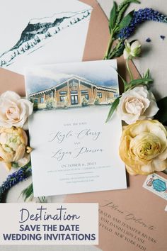 the wedding stationery is surrounded by flowers and postcards for guests to sign in