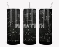 three black and white tumbles with math written on them, one has two straws in it