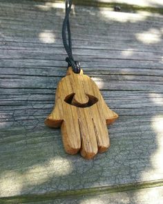 Handmade Hamsa pendant made from oak wood. Estimated shipping times North America: 2-3 weeks Europe: 1-3 weeks Natural Wood Necklaces With Wooden Beads For Gift, Gift Wooden Bead Necklaces In Natural Wood, Holistic Wooden Beads Necklace As A Gift, Holistic Style Necklace With Wooden Beads, Holistic Style Necklace With Wooden Beads For Gifts, Holistic Wooden Beads Necklace For Gift, Holistic Style Wooden Beads Necklace For Gifts, Spiritual Wood Jewelry For Gifts, Handmade Wooden Jewelry For Meditation