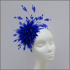 Stunning cobalt blue full feather fascinator/headpiece. Designed with different cut feathers and delicate blue pearl sprays to give this design a real unique look. Made on a headband. This design is available in other colours on request. All of our designs can be made to order in a range of Silver Fascinator, Grey Fascinator, Navy Blue Fascinator, Navy Fascinator, Black And White Hats, White Fascinator, Floral Fascinators, Mini Hats, Blue Fascinator