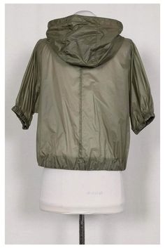 This lightweight sheer olive green jacket is perfect for airy spring days. Easily style this jacket with some cute sweats and fashion sneakers to complete your look. Size 2- IT 40 Made in Italy Concealed front zipper Gold-tone hardware Semi-sheer Short elastic sleeves Elastic hem Two front pockets Adjustable hood Bust 34" Waist 38" Shoulder to hem 20" Casual Khaki Windbreaker With Zipper Closure, Spring Khaki Windbreaker With Zipper Closure, Stretch Casual Windbreaker For Fall, Casual Stretch Windbreaker For Fall, Stretch Athleisure Outerwear For Spring, Spring Athleisure Top For Outdoor, Spring Nylon Tops, Spring Outdoor Athleisure Tops, Casual Khaki Nylon Outerwear