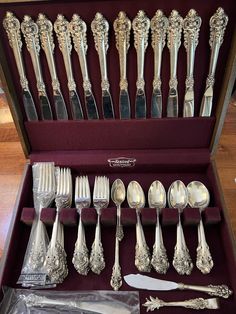 an assortment of silverware in a case