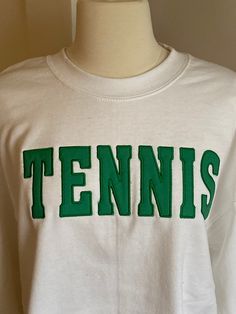 Show the world how much you love tennis by wearing this comfortable crewneck sweatshirt. Heavy weight cotton/poly blend white color crewneck sweatshirt with hot pink appliqué embroidery.  Also available at,  Painted Tree in Ballwin, Missouri Cheap Screen Print Tennis Tops, Tennis Crewneck, First Communion Banner, Tennis Sweatshirt, Appliqué Embroidery, Tennis Shirts, Blue Crewneck, Go Blue, Saint Louis