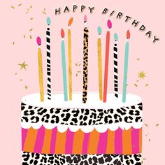 a birthday cake with candles and leopard print