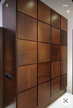 a large wooden cabinet sitting in the middle of a room