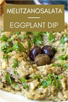 an eggplant dip with two olives in it and the words, meliznosalata eggplant dip