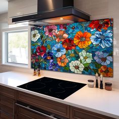 a kitchen with a stove top oven next to a large colorful painting on the wall