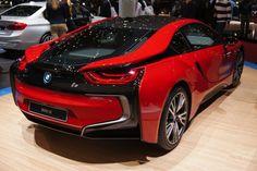 a red and black bmw concept car on display