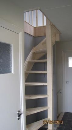 an open door leading to a staircase in a house