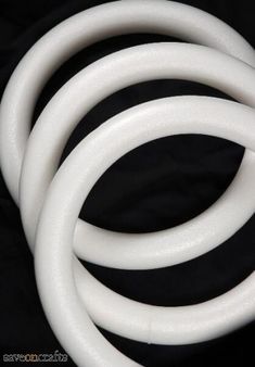 three white hoses on a black background