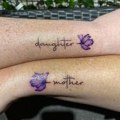 two people with matching tattoos on their arms that say,'daughter and another '