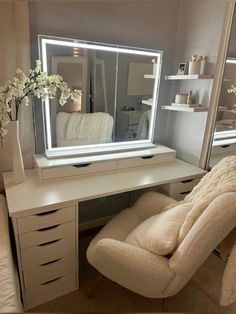 a white chair sitting in front of a mirror on top of a desk next to a dresser