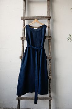 Sleeveless dress is made from 100% soft and washed linen.  Details: - Colour: Navy blue - Composition: 100% Oeko-Tex certified linen - A line style - Pockets - Linen belt included - Medium weight linen - Linen care: machine wash gentle; tumble dry low, ironing optional - The price is for one dress, other pictured items are not included Blue Linen A-line Maxi Dress, Casual Blue Linen Sleeveless Dress, Blue Linen Sleeveless Beach Dress, Blue Linen Sundress, Indigo Sleeveless Dresses For The Beach, Sleeveless Cotton Dress In Flax Color, Summer Indigo Linen Dress, Beige Sleeveless Cotton Dress, Blue Sleeveless Casual Linen Dress