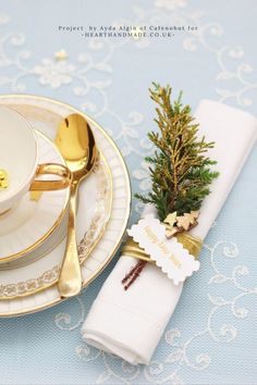 an image of a table setting with goldware and place settings on the phone screen