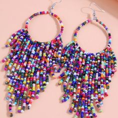 Color Block Plastic Beaded Tassel Earrings Height= 5 In Width= 1.6 Colorful Dangling Beads Earrings For Party, Colorful Beaded Dangling Earrings For Party, Multicolor Round Beads Earrings For Beach, Multicolor Round Beaded Earrings For Beach, Purple Beaded Dangle Earrings, Party Earrings With Colorful Beads, Bohemian Multicolor Beaded Earrings For Party, Party Colorful Beaded Earrings, Summer Purple Earrings With Colorful Beads