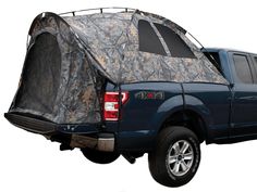 the back end of a pickup truck with a tent on it's bed,