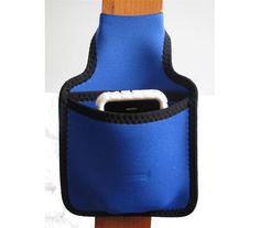 a cell phone in a blue pouch on top of a wooden pole with a black strap