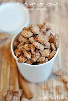 a white bowl filled with dog food on top of a wooden table