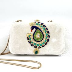 "Stand out wearing this OOAK statement hand embroidered peacock evening clutch bag with genuine moonstone, green onyx and garnets. Is it jewelry or is it a purse? It is both! Each feather is meticulously outlined in sparkly metallic gold tone thread and embellished with semi precious stones for an opulent, dazzling effect. A true gem for a peacock lover. Surprise them with this unique gift. Hand embroidered by master zardozi artisans. The word Zardozi means \"gold thread\". It is a centuries old Handmade Evening Bag For Festivals, Luxury Hand Embellished Bags For Celebration, Luxury Festive Evening Bag As Gift, Luxury Festive Evening Bag Gift, Bohemian Rectangular Wedding Clutch, Bohemian Wedding Clutch Rectangular, Luxury Openable Clutch As A Gift, Elegant Handmade Shoulder Bag For Festivals, Elegant Handmade Shoulder Bag For Festive Season