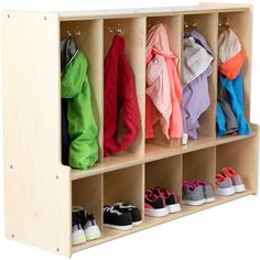 a wooden shelf with several pairs of shoes hanging on the hooks and clothes in them