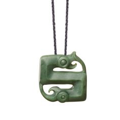 a green jade pendant on a black cord