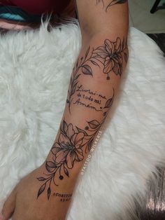 a woman's arm with flowers on it and the words, i love you so much