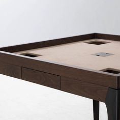 a wooden table with two drawers on each side and one drawer at the top that is open