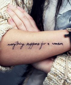 a woman's arm with a tattoo saying anything happens for love