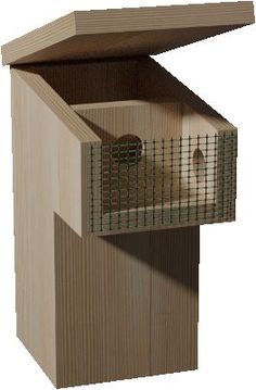 a wooden bird house with a cage in it's top half and the door open