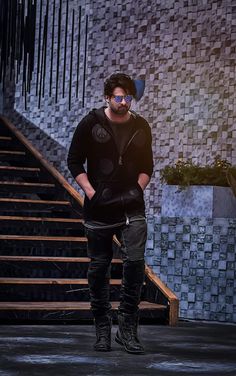 a man standing in front of some stairs